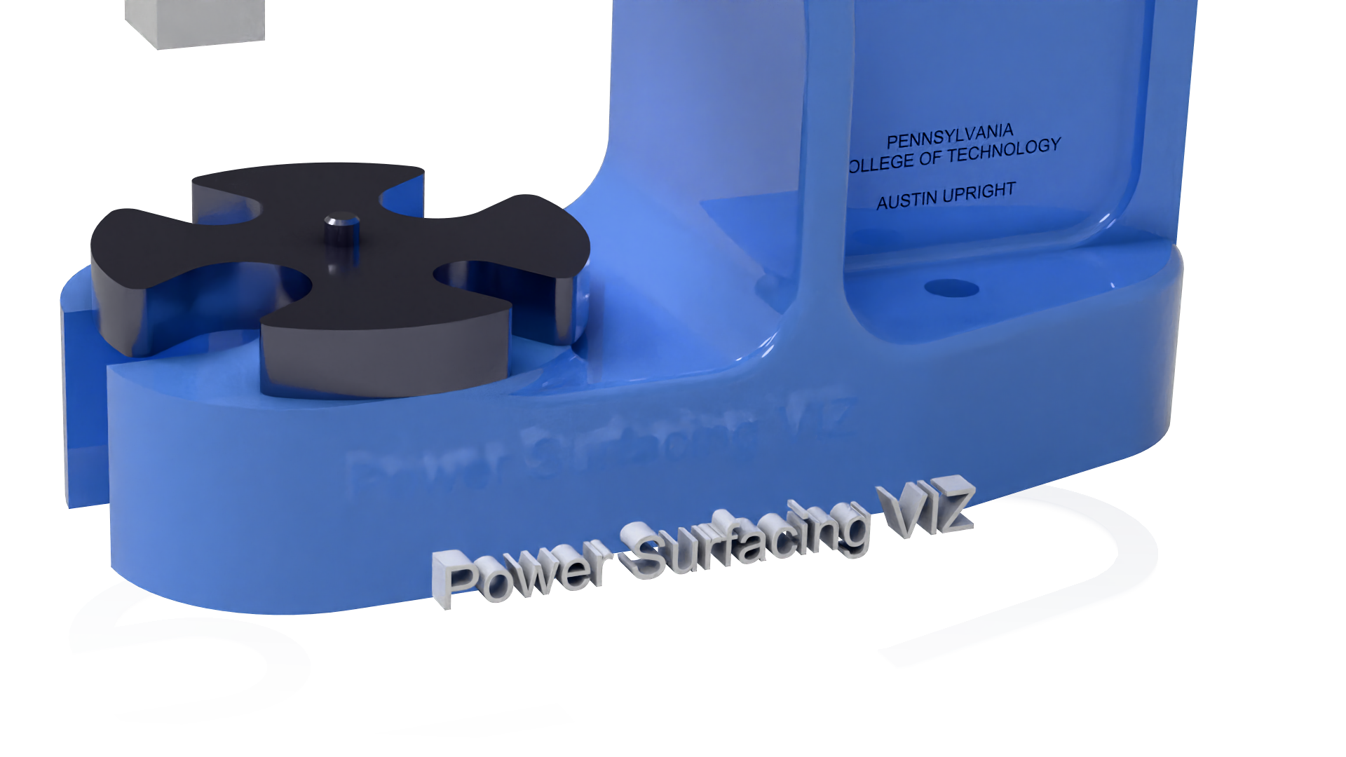 Power Surfacing VIZ text geometry positioned in front of the blue arbor press base before cutting