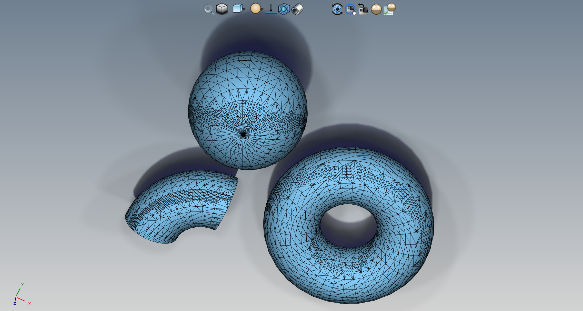 Top view of the sphere, elbow and torus with visible triangle edges showing the tessellated mesh