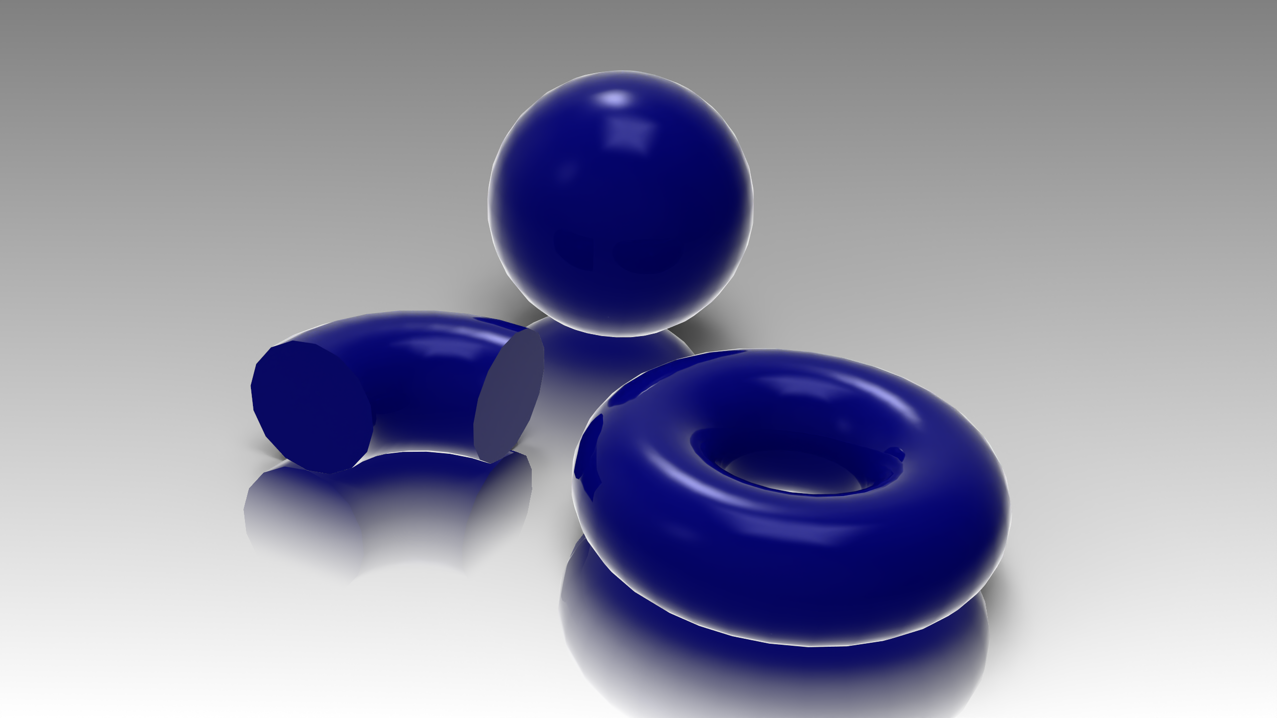 Blue rendered sphere, elbow and torus without View-Based Tessellation, showing faceted edge outlines
